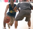 Kriss La Touche, excercise physiology sophomore, dribbles around Michael Toliver, Rider high school student, driving the ball to the net, during the basketball tounament, Swishes 4 Wishes, put on by Chi Omega, March 12. Photo by Rachel Johnson