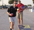 Austin Leverage, finance junior, tosses the ball while his partner, Jared Rivas, biology sophomore, during a game of bean bag toss set up by Sigma Alpha Epsilon in the new designated tailgating section of the parking lot outside of Memorial Stadium, Saturday Sept. 5, 2015. Midwestern State beat Truman State 31-3 in their opening game of the season. Photo by Rachel Johnson