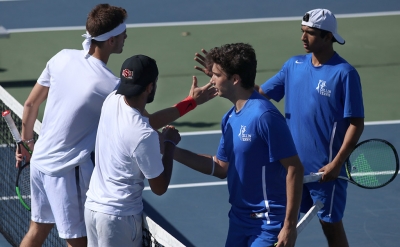 Angel Palacios, business management sophomore, and Joshua Sundaram, mechanical engineering sophomore, shake hands with their opponents after winning 8-2 during the Collin College vs. MSU tennis meet at MSU on Friday, Feb. 9, 2018. Photo by Francisco Martinez