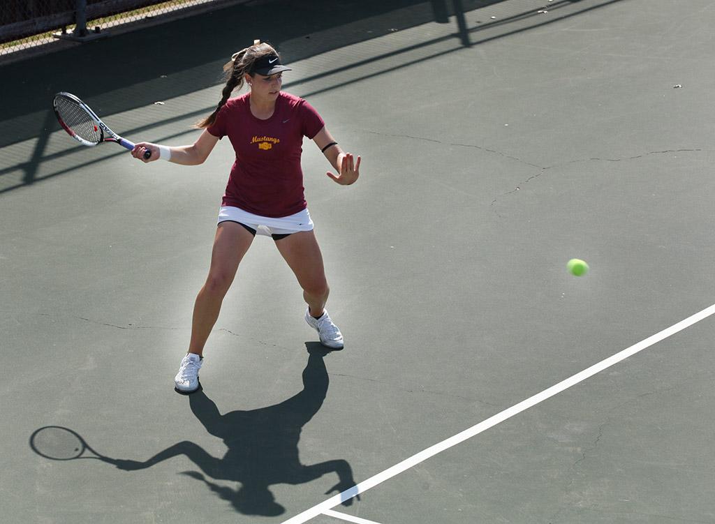 Greta Lazzarotto, management sophomore, returns the ball to the other side during a doubles game against Metro State at the MSU Tennis Center. Photo by Rachel Johnson