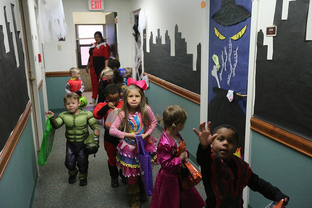 The kids of YMCA trick or treat in Killingsworth Residence Hall at Midwestern State University. Photo by Justin Marquart