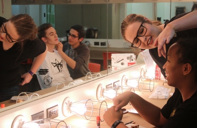 Urinetown cast members practice applying the characterâs make-up design for the first time in the dressing room on Friday, Feb.16, 2018. Photo by Joanne Ortega