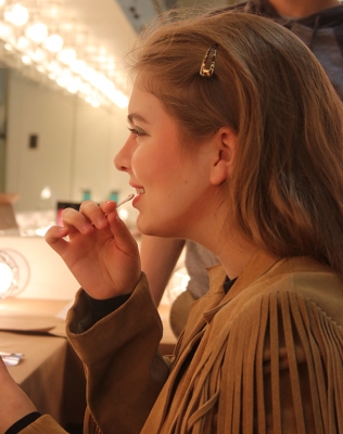 Haley Hancock, music freshman, adds the finishing touches to her characterâs make-up during the first make-up call held in the dressing room on Friday, Feb.16, 2018. Photo by Joanne Ortega