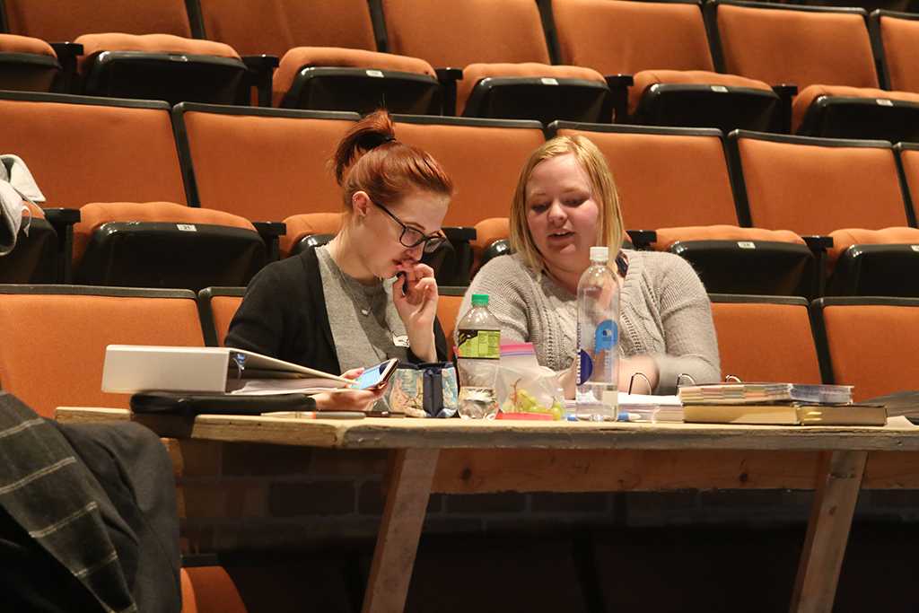 Katie Cagle and Emily Burns at rehearsal for the Midwestern State University production of Urinetown. Photo by Bradley Wilson