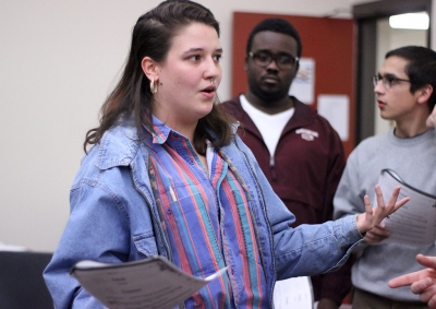 Ellanor Collins, theater senior, practices hitting her character's notes during the first rehearsal of UrineTown. Photo by Rachel Johnson