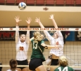 Kendall Chamberlain, nursing freshman, and Olivia Schiffner, excersize physiology freshman, go up to block a spike from an Eastern New Mexico Univeristy player during the game held in D.L. Ligon Coliseum, Oct. 27. MSU lost to ENMU 1-3. Photo by Rachel Johnson