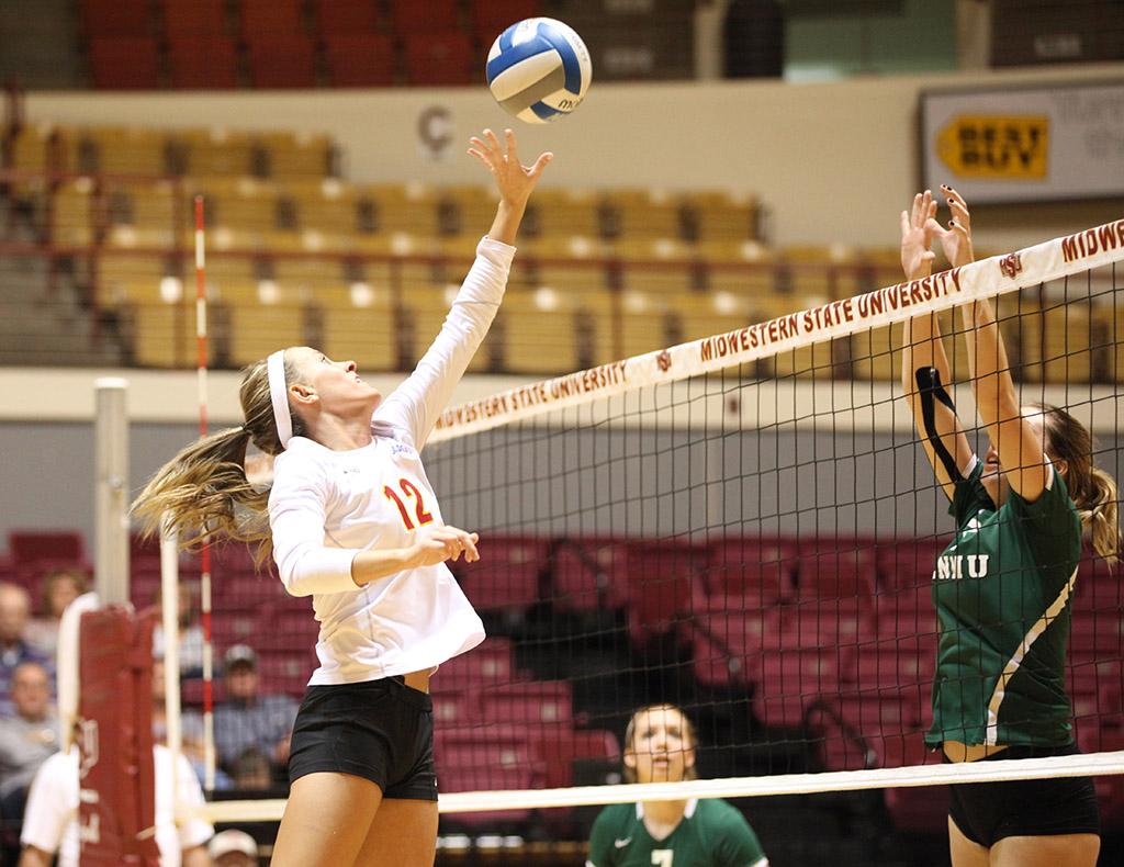 Kiley Beaver, nursing freshman, tips the ball onto the other side during the game held in D.L. Ligon Coliseum, Oct. 27.  MSU lost to Eastern New Mexico University 1-3. Photo by Rachel Johnson
