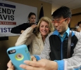 Wendy Davis, gubernatiorial candidate, takes a selfie with Newman Wong, research analyst for Institutional Research at Midwestern State University, at the Wichita Falls County Democrats headquaters Saturday, Nov. 1, 2014. Photo by Lauren Roberts