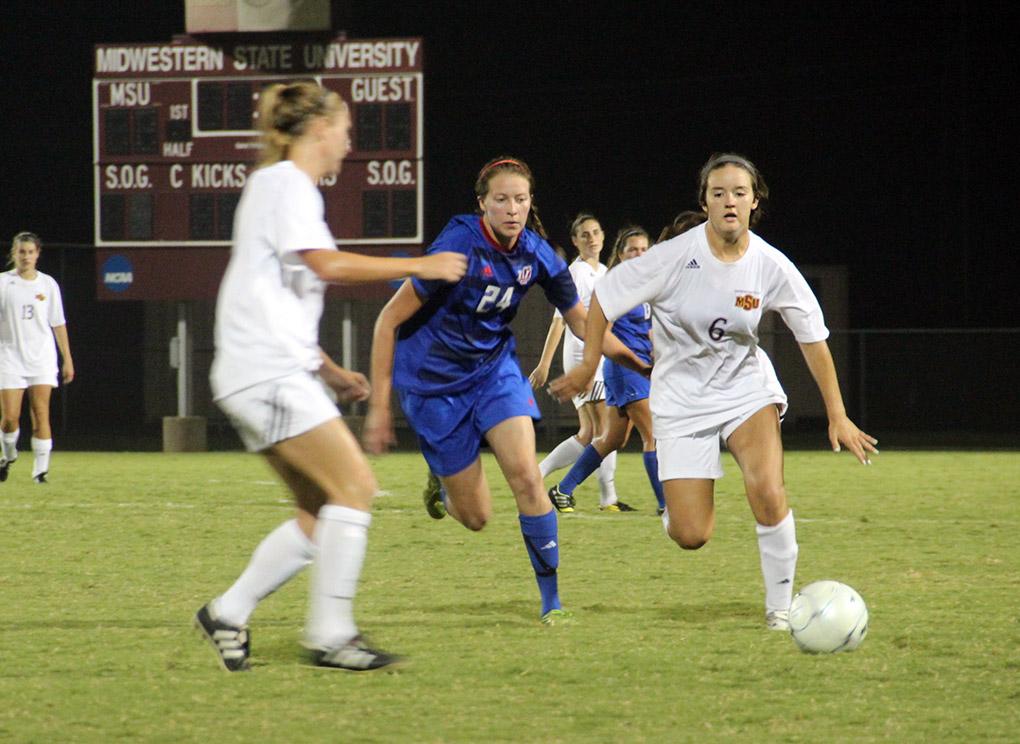 Lizzie Navarette, business marketing sophomore, trys to make it past a defender against Lubbock Christian University Sept. 19 at the MSU Soccer Field. MSU won 2-1. Photo by Miguel Jaime
