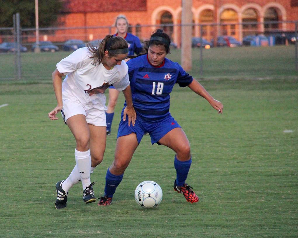 Ashley Cottrell, environmental science junior, trys to gain control of the ball against Lubbock Christian University Sept. 19 at the MSU Soccer Field. MSU won 2-1. Photo by Miguel Jaime