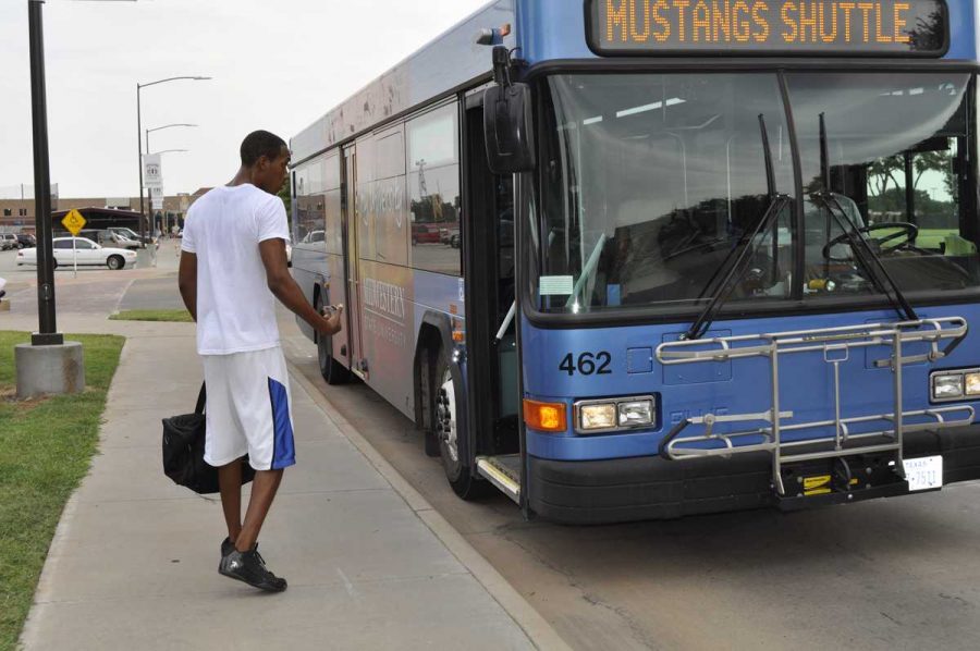 Sophomore Adrian Hurst boards the Mustangs Shuttle after a day of classes on Monday. As a Caribbean student from Antigue, Hurst said without the Mustangs Route he would have to walk in the heat to and from class. (Photo by Hannah Hofmann)