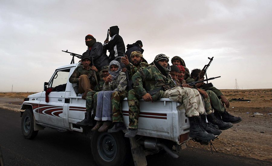 Rebel Fighters crowd a truck as they leave Bin Jawwad, Libya, on March 29, 2011. (Luis Sinco/Los Angeles Times/MCT)