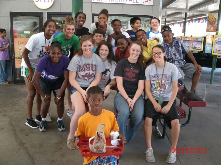 Lady Mustangs and the kids of Washington-Jackson team up for a group photo at Sonic on Kemp. (Photo courtesy)
