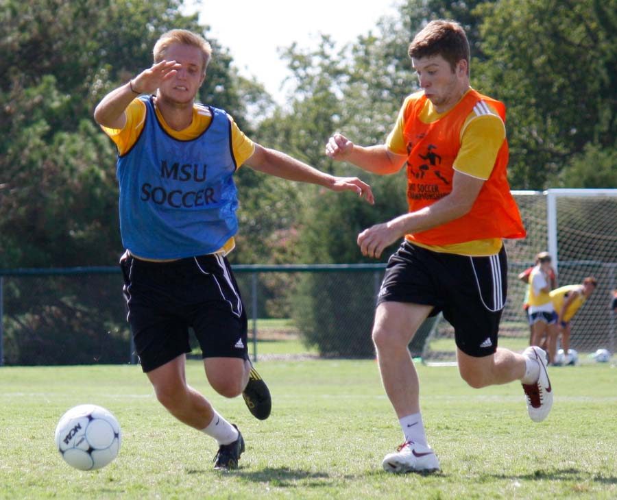 File photo: Sam Broadbent (right), pictured during a soccer practice earlier in the semester, was able to assist a goal Friday night. (Photo by Damian Atamenwan)