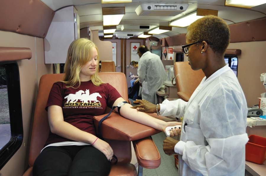 MSU junior Katherine McDaniel seen donating blood Tuesday afternoon. McDaniel has donated blood more than 15 times. (Photo by Hannah Hofmann)