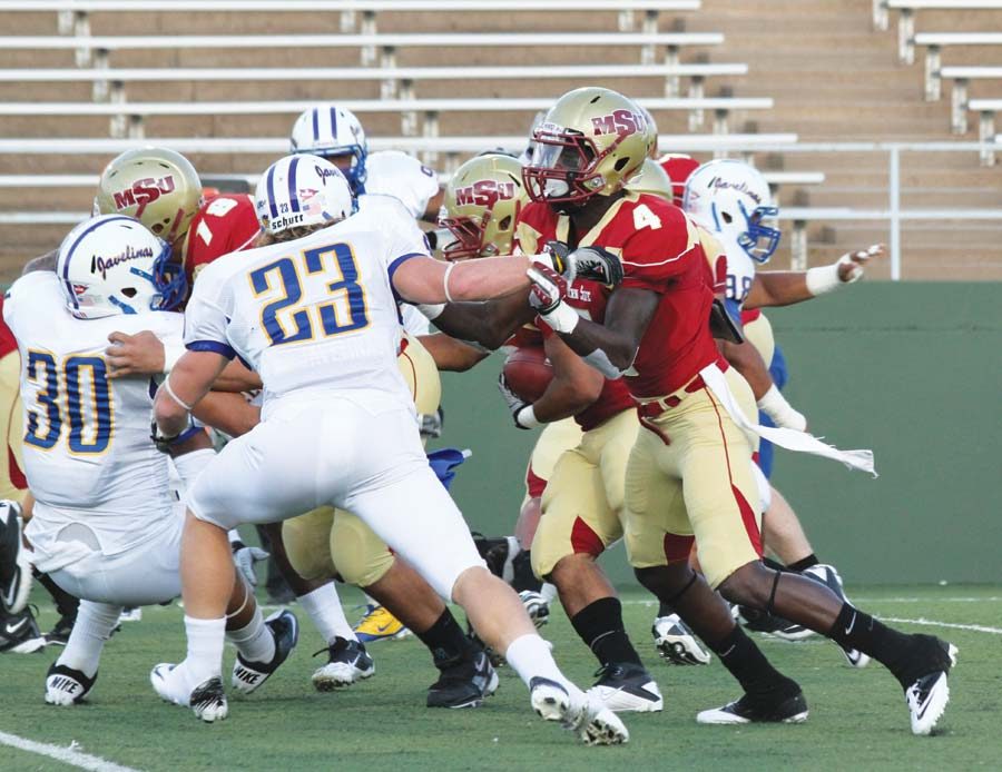 Midwestern State University’s attack drives towards Texas A&M University Kingsville’s defense to gain field positioning in last weekend’s victory against the Javelinas. (Photo by Kassie Bruton)