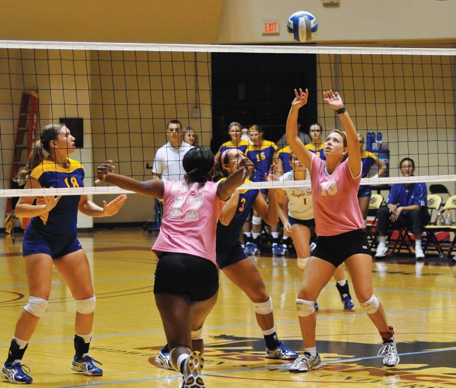 Freshman Setter Kristina Aduddell sets Senior Outside Hitter Miranda Byrd for a kill in Saturday afternoons encounter against the Rambelles of Angelo State University. (Photo by Hannah Hofmann)