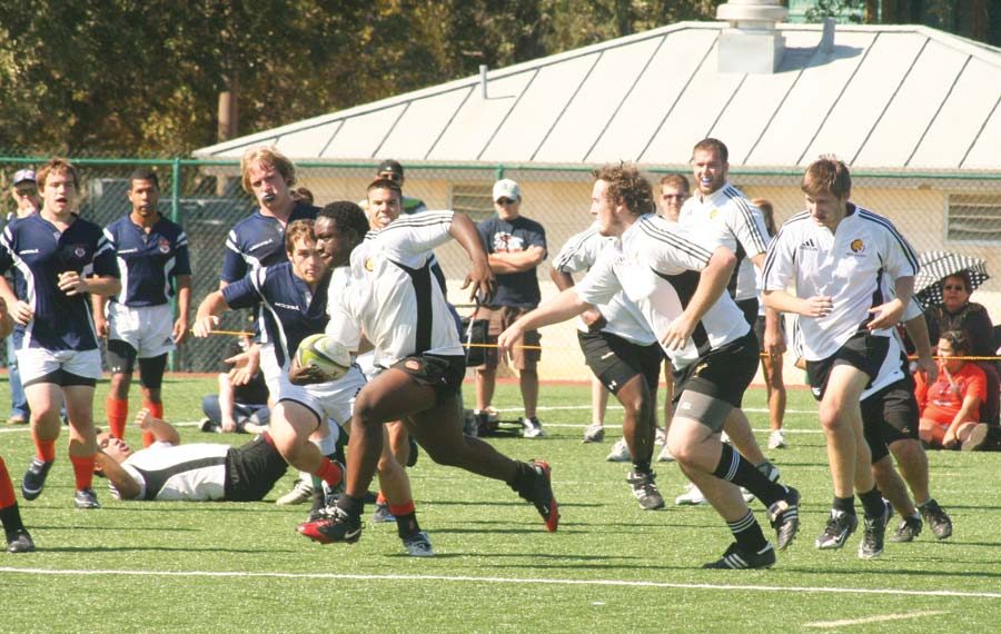 Simba Musarurwa goes for his second try. The sophomore scored three tries against the Roadrunners. (Photo by Rod Puentes)