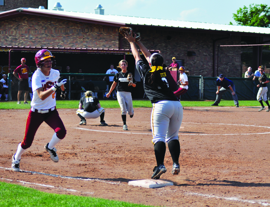 Junior outfielder Elena Bennett runs to first base against Cameron University. Photo by Hannah Hofmann