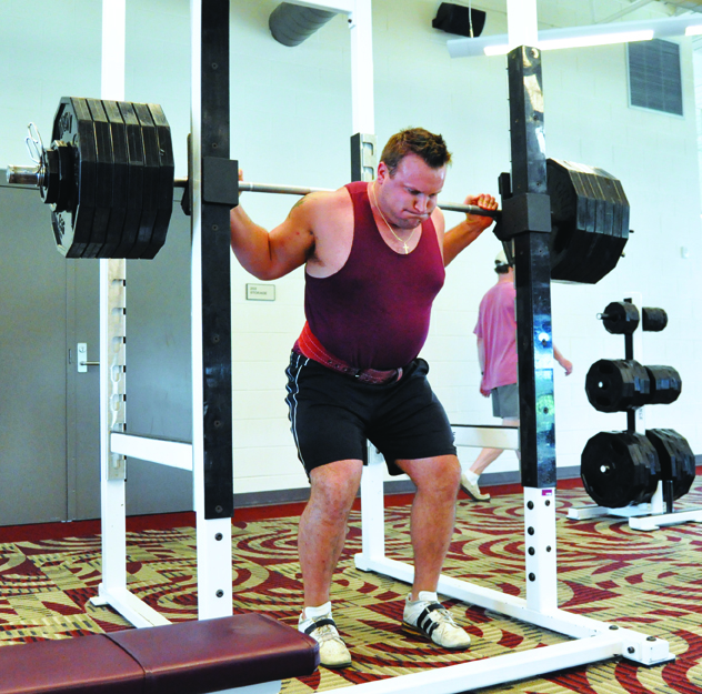 Chris Riley prepares to squat thrust more 600 pounds. Photo by Hannah Hofmann
