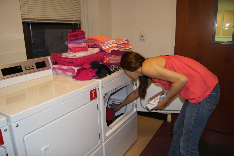 MSU freshman Jenna Degnan seen doing laundry.  
Photo by BEKAH TIMM