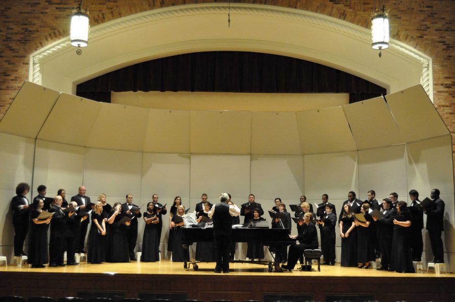 The choir warms up before their fall concert on Tuesday in Akin Auditorium. 
Photo by MEGHAN MYRACLE