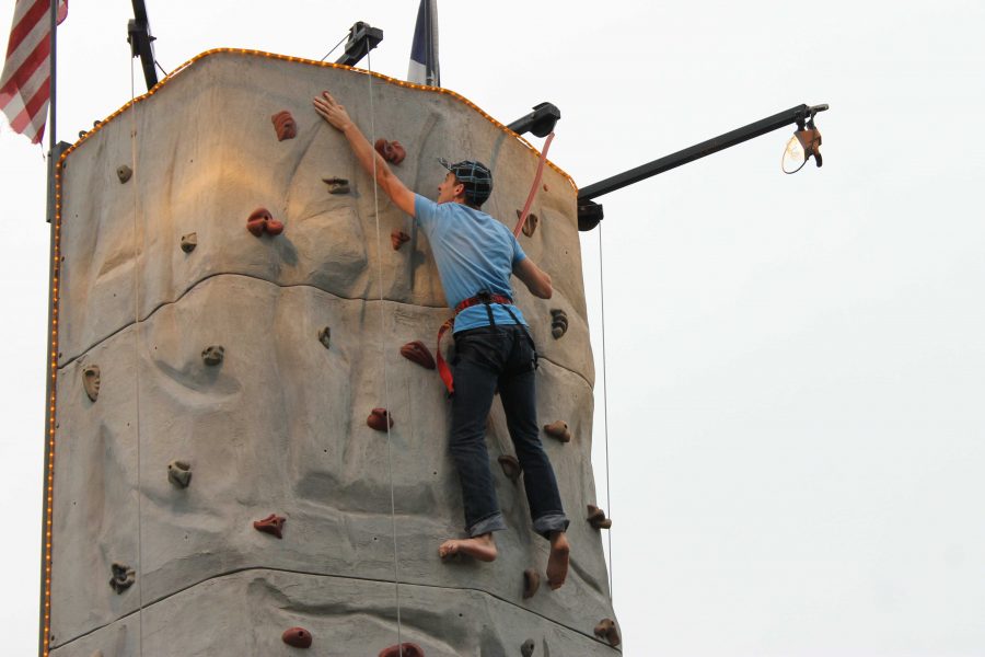 A visitor reaching the top of the climbing wall.
Photo by SHANICE GLOVER