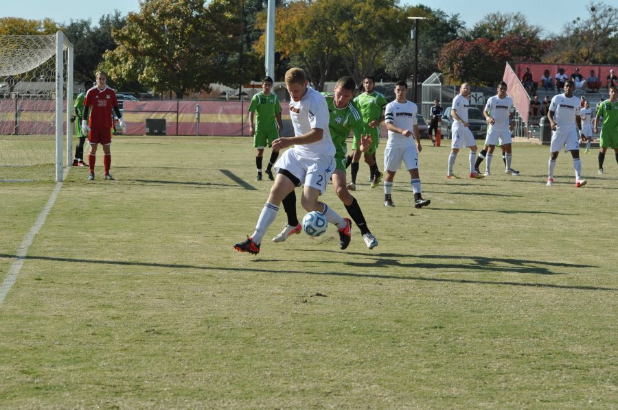 Michael Brody shields the ball from a defender.
Photo by KERRI CARTER