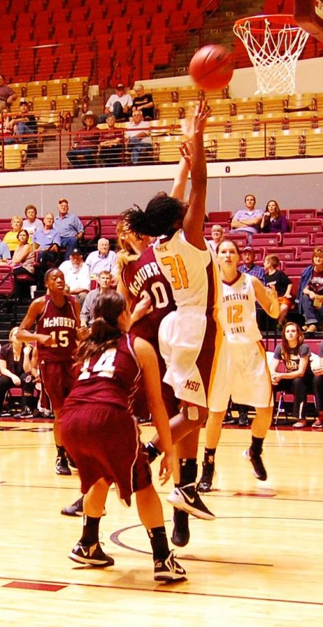 Shatoia Gober goes up for a rebound against a McMurray defender.
 Photo by HANWOOL LEE