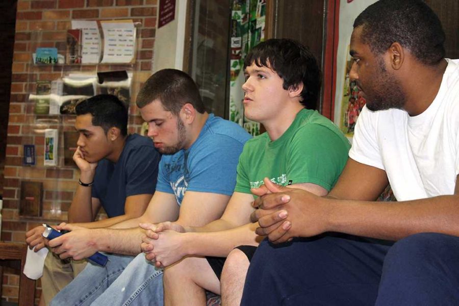 James Owen, freshman, physical therapy; Justin Wotring, sophomore, accounting; Jaden Corbin, sophomore, mechanical engeneering; Tommy Stewart; freshman, business. Students gather as bible study begins.
Photo by Shanice Glover