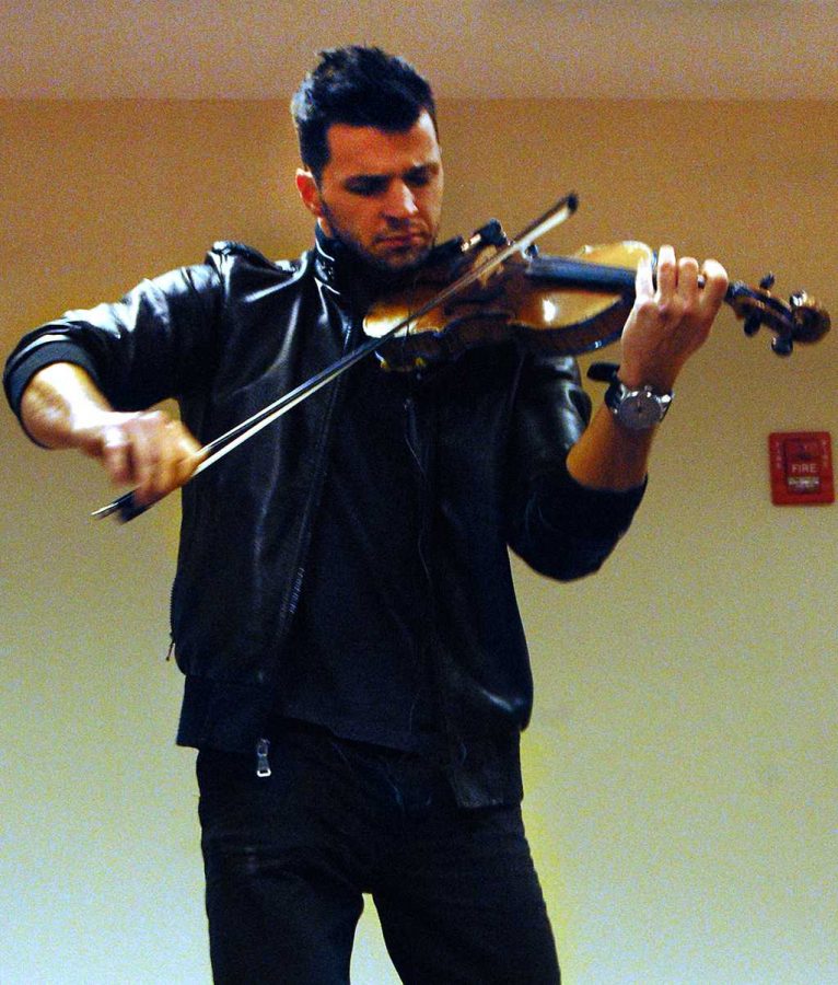 The hip hop violinist, Svet,performs the violin in Comanche Suites.