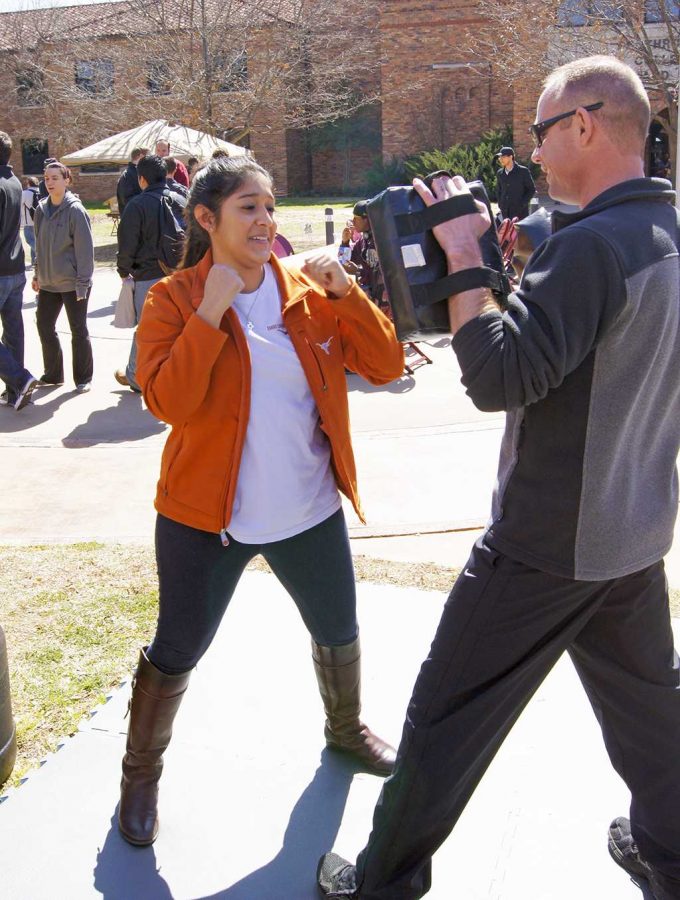 Arianna Rojas takes on the challenge of self defense at the Safe Spring Break Fair on Tuesday.
Photo by Rebecca Timm