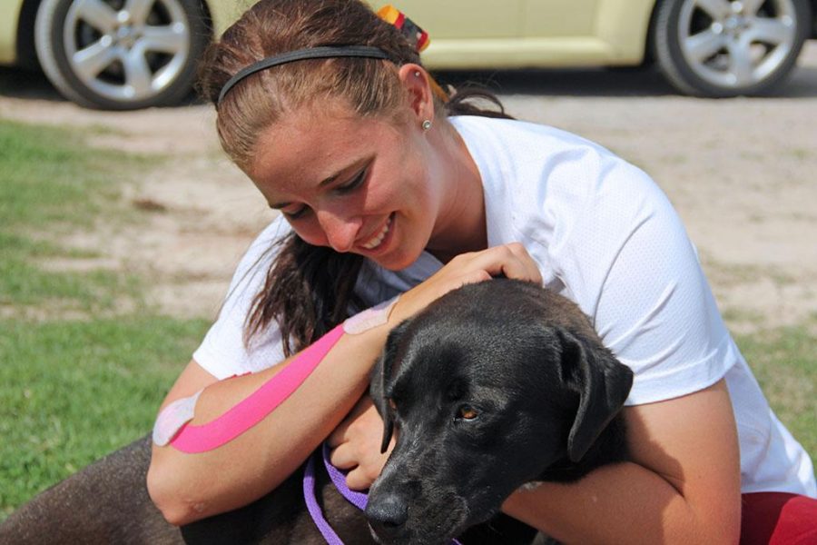 Chelsey Wall, Freshman, Athletic Training plays with the dog she finished adopting, Janie.  The one thing I missed after coming to college is a dog.