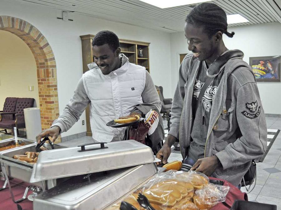 Simon Karirire, a Sophomore in Geosciences and Accounting, and Michael Washington, a Sophomore in Criminal Justice, grab a bite to eat, provided by EURECA (Enhancing Undergraduate Endeavors & Creative Activities) which is part of Quality Enhancing Plan (QEP). The school is trying to implement the plan to help students with career opportunities and life experiences.