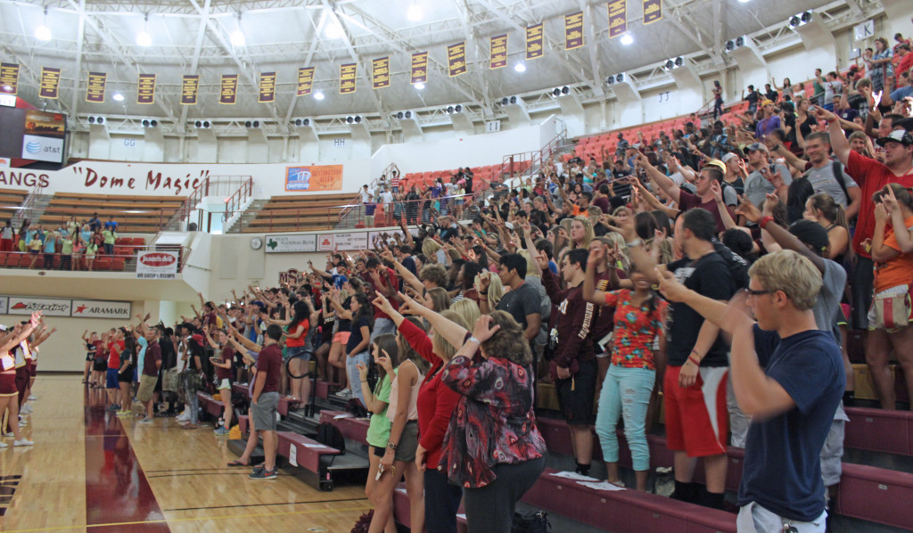 Students sing the Alma Mater at the end of the convocation on Tuesday, Aug. 27, at D.L. Ligon Coliseum.