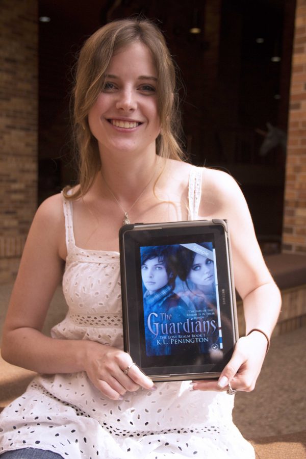 Kendell Penington, sophomore  in English, with her first published book — The Guardians: The Lost Realm.