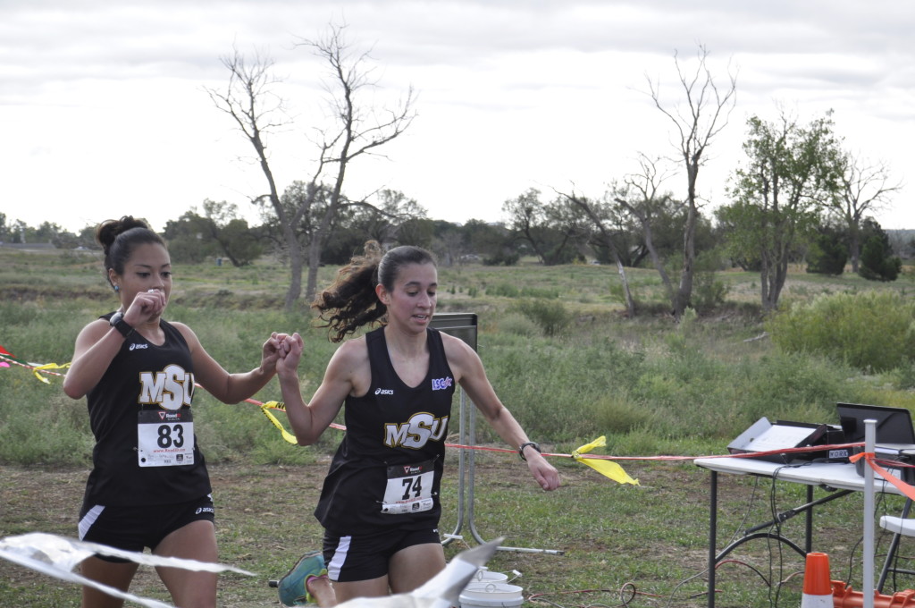 Ashley Flores, senior in sociology and Gabby Ruiz, junior in nursing, finished the race hand-in-hand each covering the 6k course in 23:16.60 in the Cross country carnival on Oct. 12. The cross-country team placed 1st-7th, getting a perfect score of 15, winning the MSU Cross Country Carnival team title. Flores said, "We were having good pace and it was really good. So we just finished together."