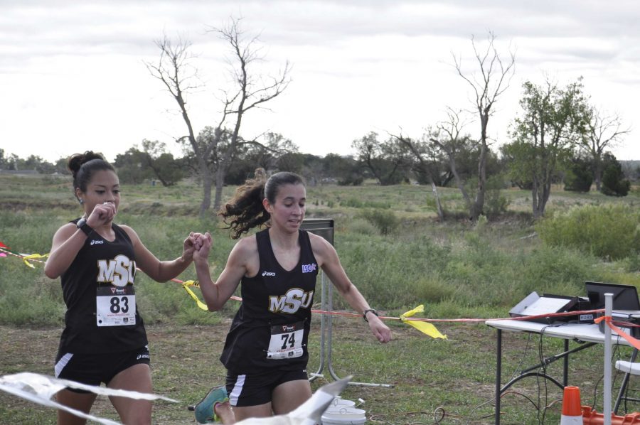 Ashley Flores, senior in sociology and Gabby Ruiz, junior in nursing, finished the race hand-in-hand each covering the 6k course in 23:16.60 in the Cross country carnival on Oct. 12. The cross-country team placed 1st-7th, getting a perfect score of 15, winning the MSU Cross Country Carnival team title. Flores said, We were having good pace and it was really good. So we just finished together.