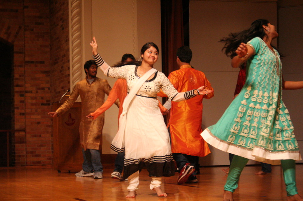 Photo by Roy Richeson.  Dipika Nayuk, graduate in exercise physiology, dances to contemporary Indian pop music to show students the culture and customs of Indian students at Diwali in Akin Auditorium on Friday, Nov. 15. "We want you to take back home the different colors, the different kind of foods and basically our culture," Nayuk said.