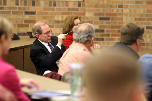 During the faulty senate meeting Tuesday afternoon President Jesse Rogers listens to master planners explain possible changes for the Midwestern State campus. Photo by Lauren Roberts.