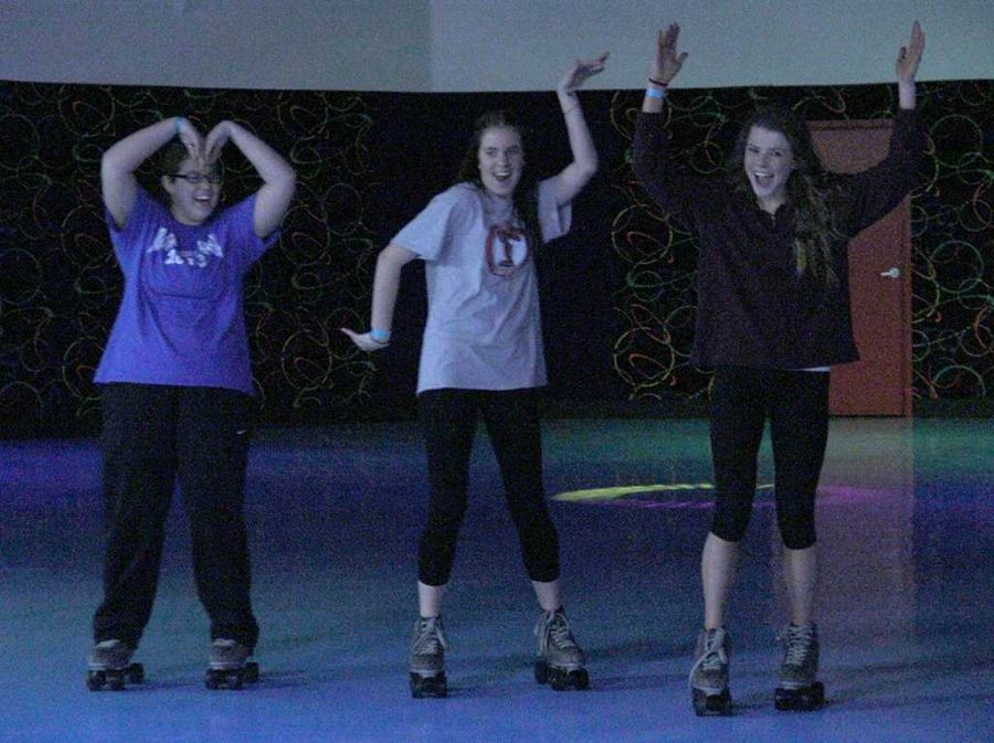 Mikayla Morrison, freshman in phychology, Peydon Stivrs, frashman in radiology, and Destiny Zynda, frashman in exercise physiology, attempt an  MSU formation on the skating rink at BSUs Roller Bounce event on Feb. 13. Zydna said, I saw the poster in the hall and thought, Hey, free skating!