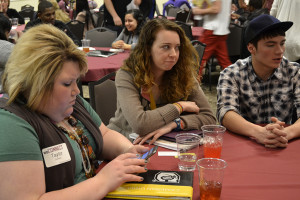 Taylor Dunham, junior in art, Kailee Williams, junior in social studies, and Tim Thompson, freshman in multimedia design, wait for the second breakout session at the WeConnect Conference on Feb. 22.