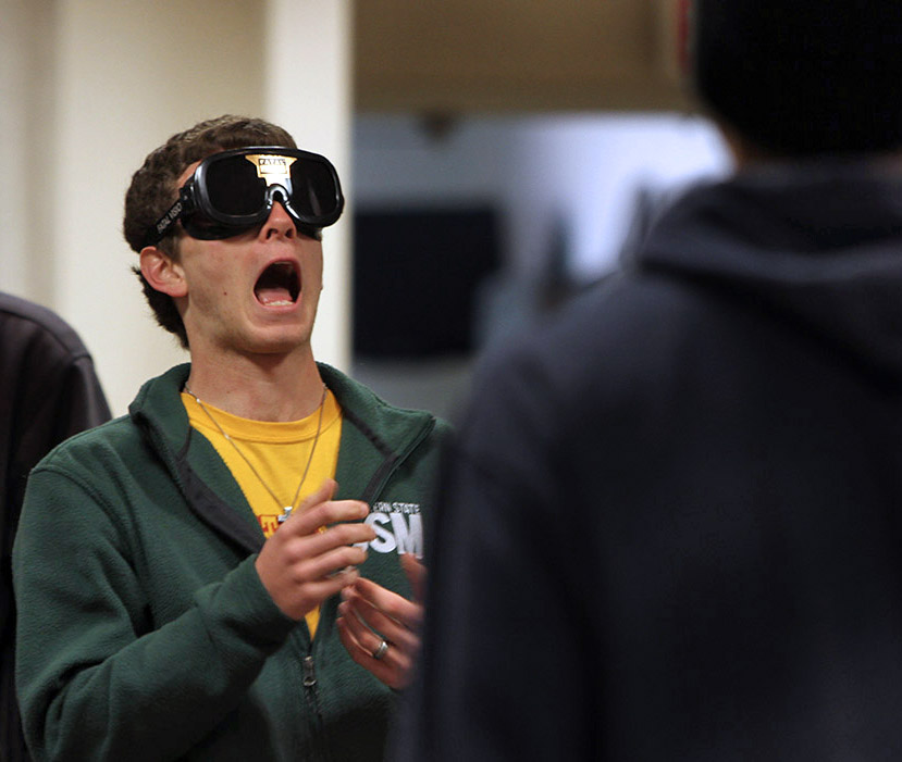 Michael Lamberti, freshman in mechincal engineering, tries to catch a ball at the sobriety test booth ran by the police department at safe spring break held in the Clark Student Center Comanche Suite Tuesday afternoon. Photo by Lauren Roberts