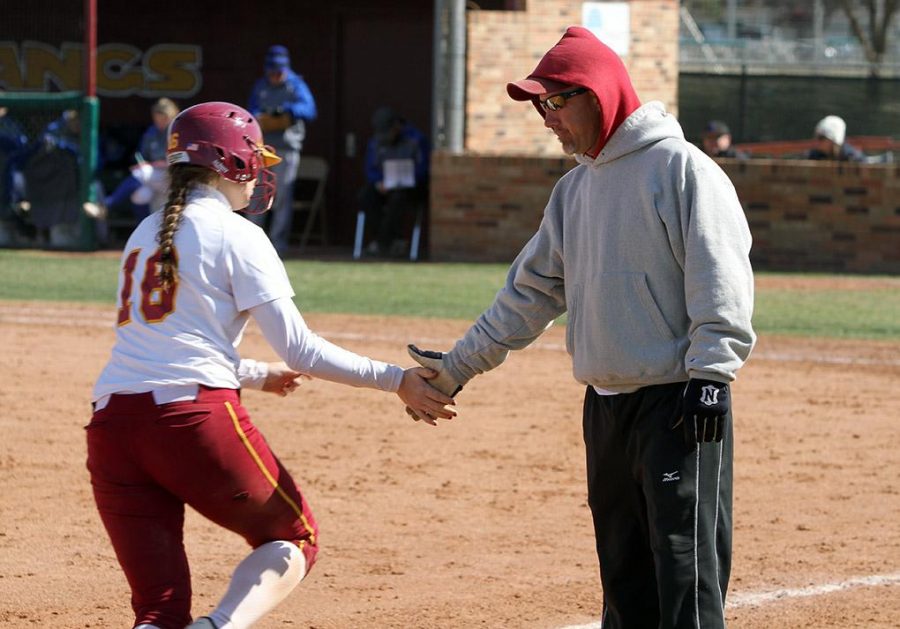 Kim Jerrick, senior in physical therapy, gets a low-five from head softball coach Brady Tigert after hitting a three-run homerun in the final inning. The softball team defeated Texas A&M-Kingsville 16-5 in the final game of the four-game series at Mustang Field. The team is 11-1 in Lone Star Conference play. The next series is against Angelo State University Friday and Saturday in San Angelo. Photo by Lauren Roberts
