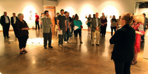 Marla Ziegler gives the gallery talk on her sculpture exhibit to crowd of about 30 students, faculty and community members for the opening reception at the Wichita Falls Museum of Fine Art at Midwestern State University. Photo by Ethan Metcalf.