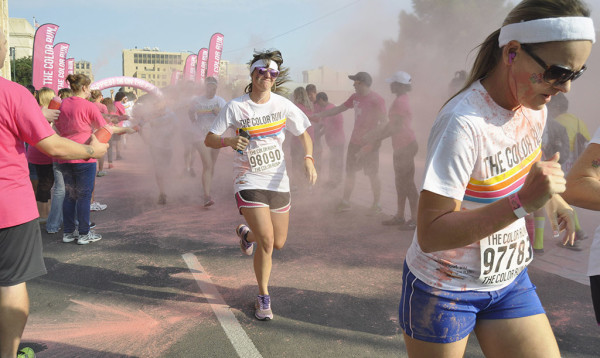 Rachael Krygsman, senior in english passed pink line at the color run race.The distinctive quality of this race is that the runners get doused with a color chalk every kilometer, encouraging them to push to the next color.
