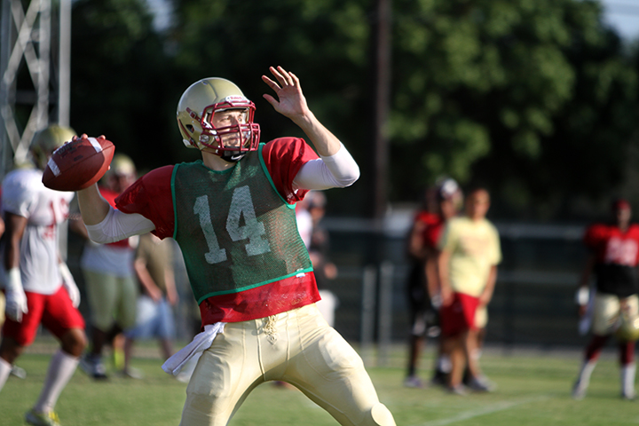 Quade Coward passes during a drill at practice Thursday at the practice fields. Photo by Lauren Robert.