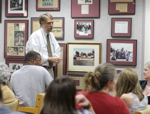 Todd Giles, assistant professor of English, answers questions after his lecture Thursday over banned books on the second floor of Moffett library. Photo by Lauren Roberts