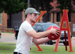 Pitcher Sam Shirley, kinesiology sophomore, attempts to strike the pledges during the Kappa Alpha kickball game. Photo by Rachel Johnson