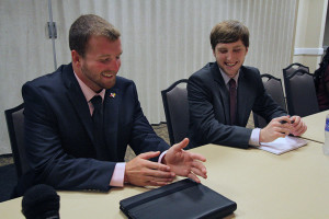 Jesse Brown, junior in criminal justice and business, and Matt Milholloe, junior in finance, converse during the Student Government Association's first meeting Sept. 3. Photo By Yasmin Persaud